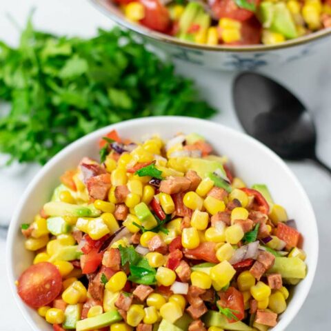 Portion bowl of the Corn Salad with the larger bowl in the background.