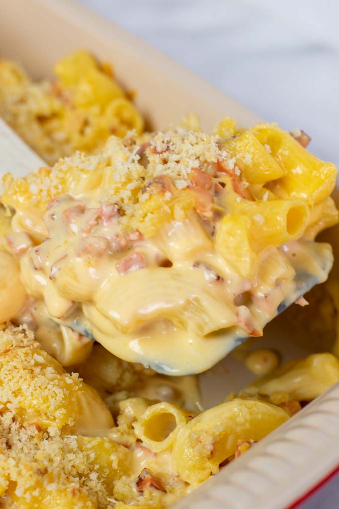 Showing the creamy sauce running from the macaroni.