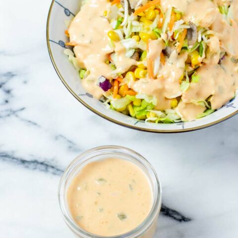 Large salad bowl with Thousand Island Dressing.