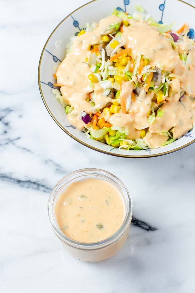 Large salad bowl with Thousand Island Dressing.