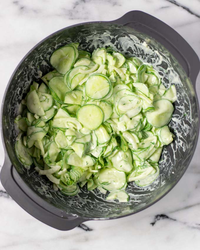 Top view of the Creamy Cucumber Salad in a large mixing bowl.