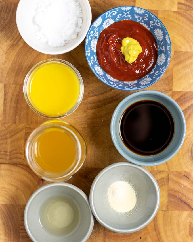 Ingredients for the Hawaiian Sauce assembled on a wooden board.