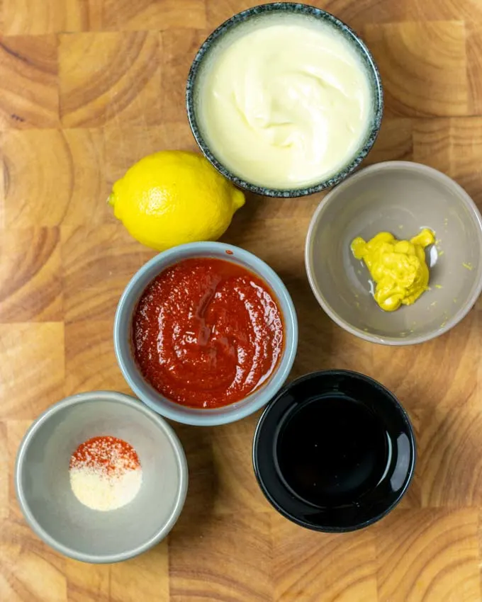 Ingredients for the Comeback Sauce assembled on a wooden board.