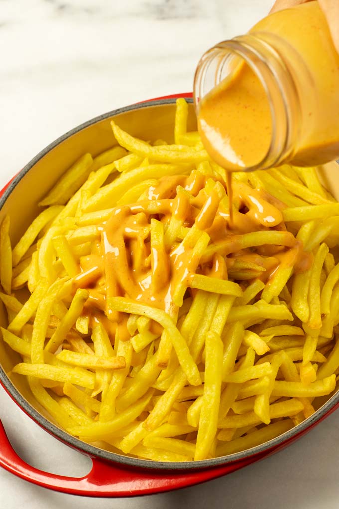 Comeback Sauce is poured over fries.