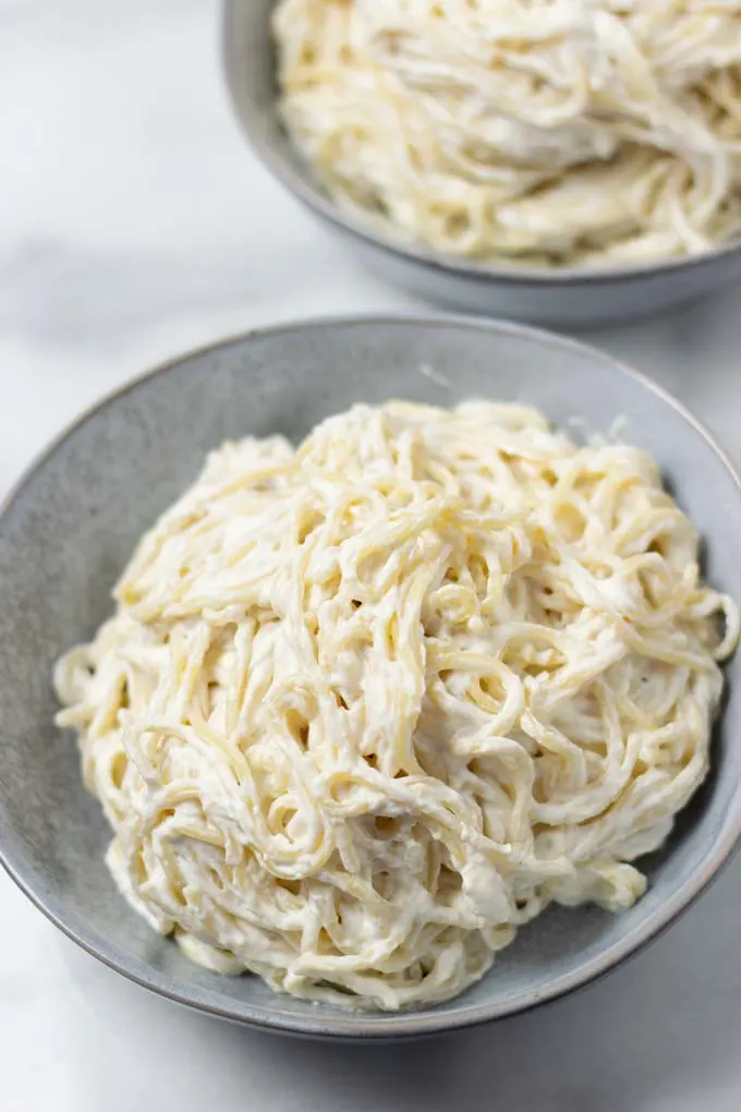 Two portions of the Ricotta Pasta in grey bowls.