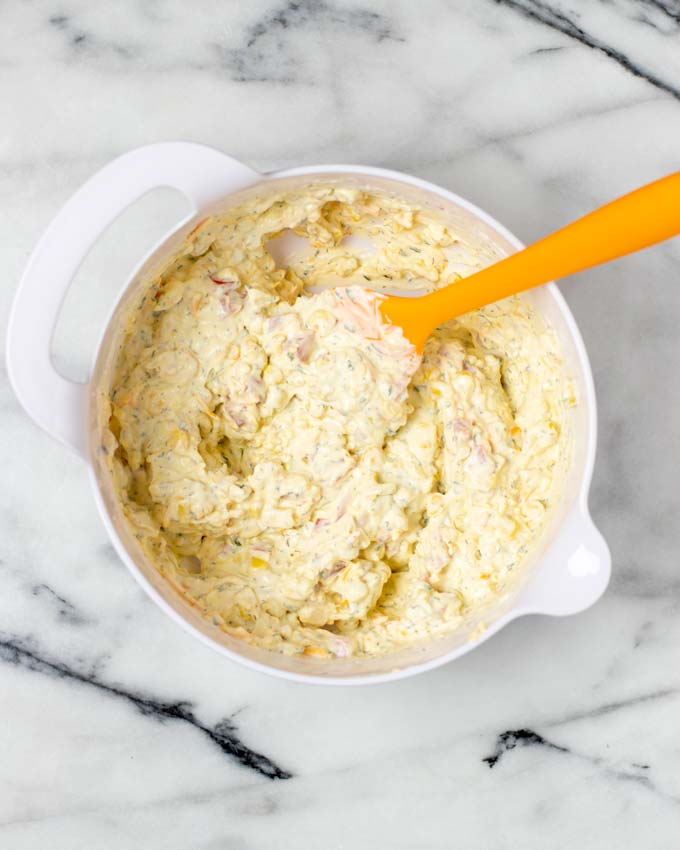 A large white mixing bowl with the mixed homemade Fiesta Ranch Dip.