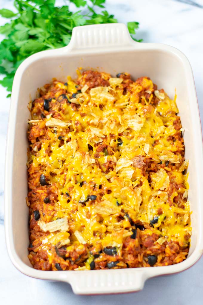 View of the Rice Dish in a casserole dish after baking, topped with crushed chips.