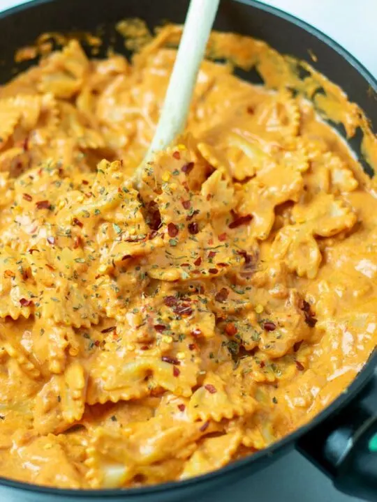 Closeup on the Creamy Tomato Pasta, garnished with chili flakes.