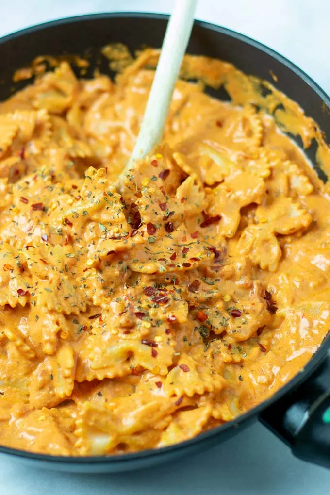 Closeup on the Creamy Tomato Pasta, garnished with chili flakes.