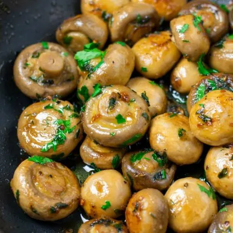 Frying pan full of Garlic Mushrooms/