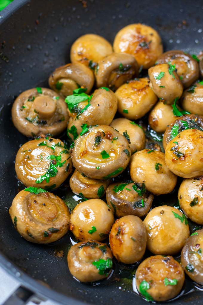 Frying pan full of Garlic Mushrooms.