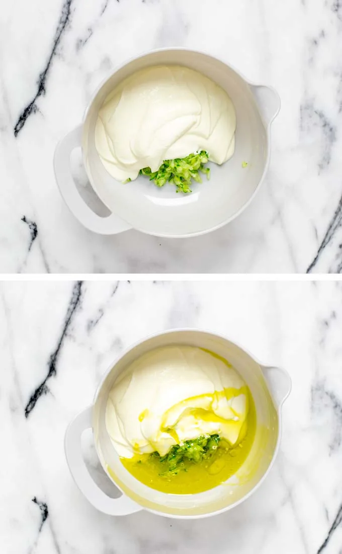 Grated cucumbers are mixed with Greek yoghurt and olive oil in a large mixing bowl.