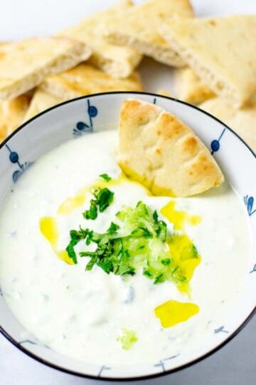 Bowl of the Tzatziki Sauce with toasted pita bread.