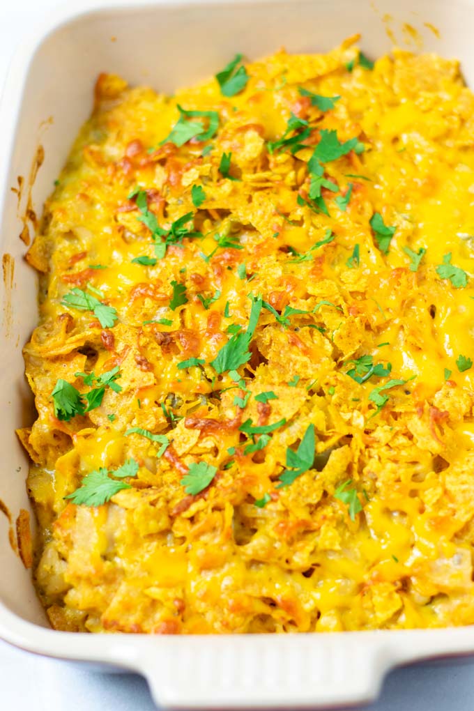 Closeup of a casserole dish with the Nacho Chicken garnished with fresh cilantro.