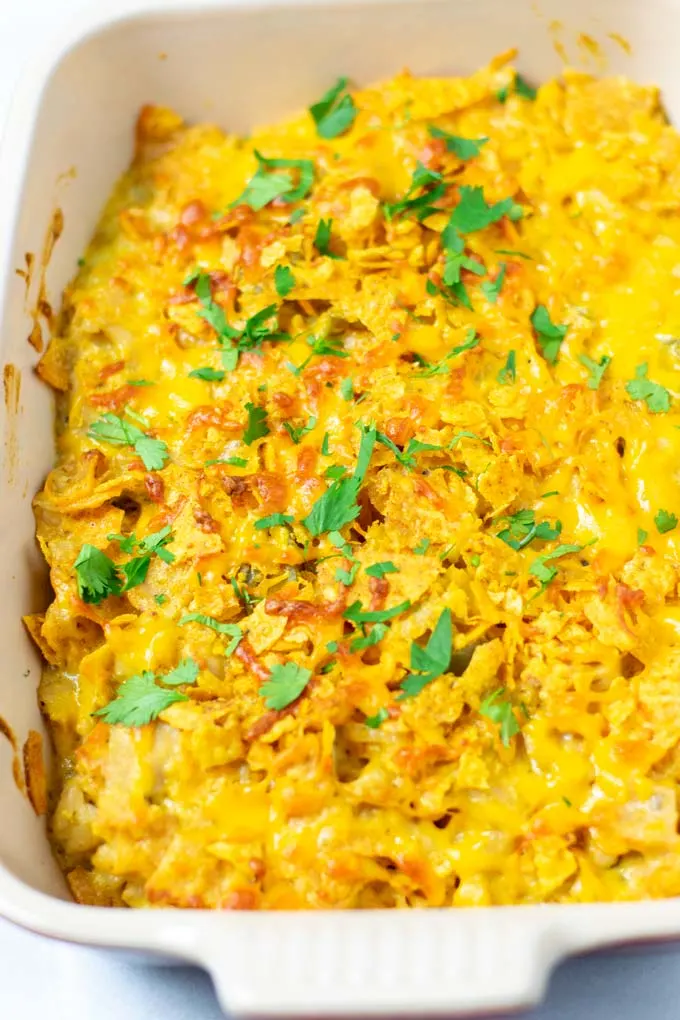 Closeup of a casserole dish with the Nacho Chicken garnished with fresh cilantro.