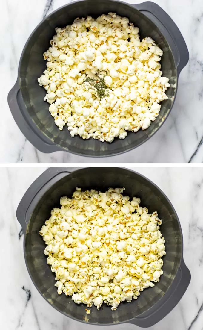 Popcorn is mixed with oil and spices in a large mixing bowl.