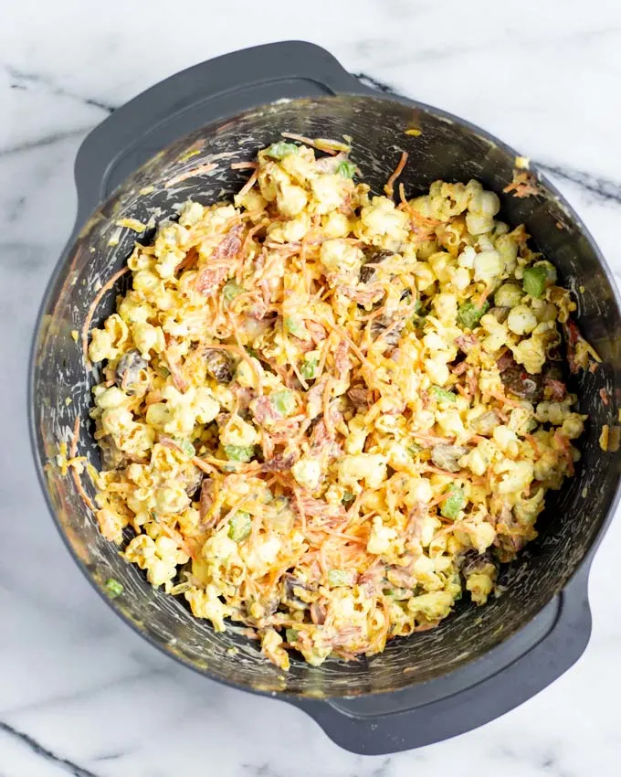 View of the ready mixed Popcorn Salad in a large mixing bowl.