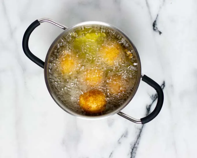 The Potato Cheese Balls are deep fried in oil.