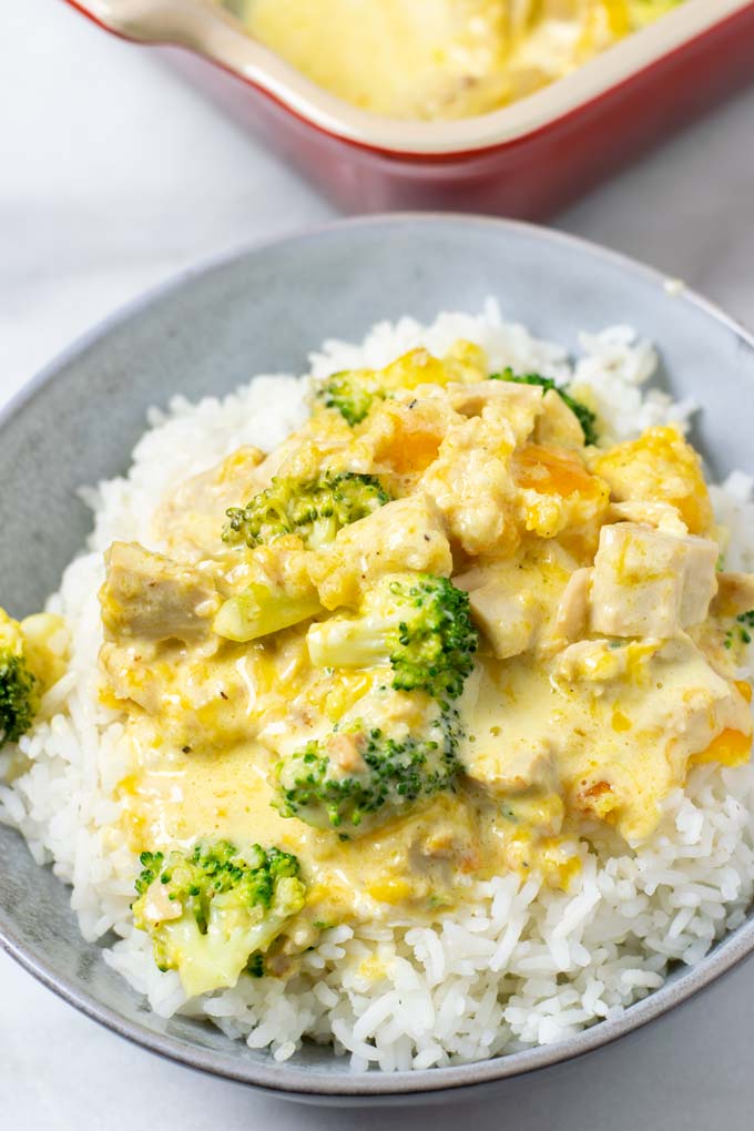 A portion of the Chicken Divan is served over white rice.