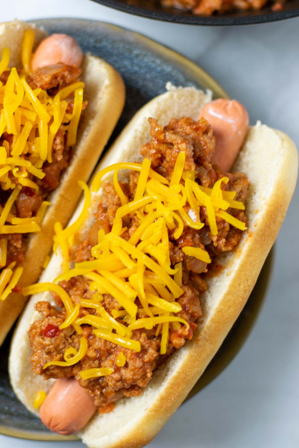 Top view of two hot dogs with the Hot Dog Chili.