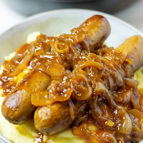 Large portion of the Mashed Potatoes with Sausages with lots of onion gravy.