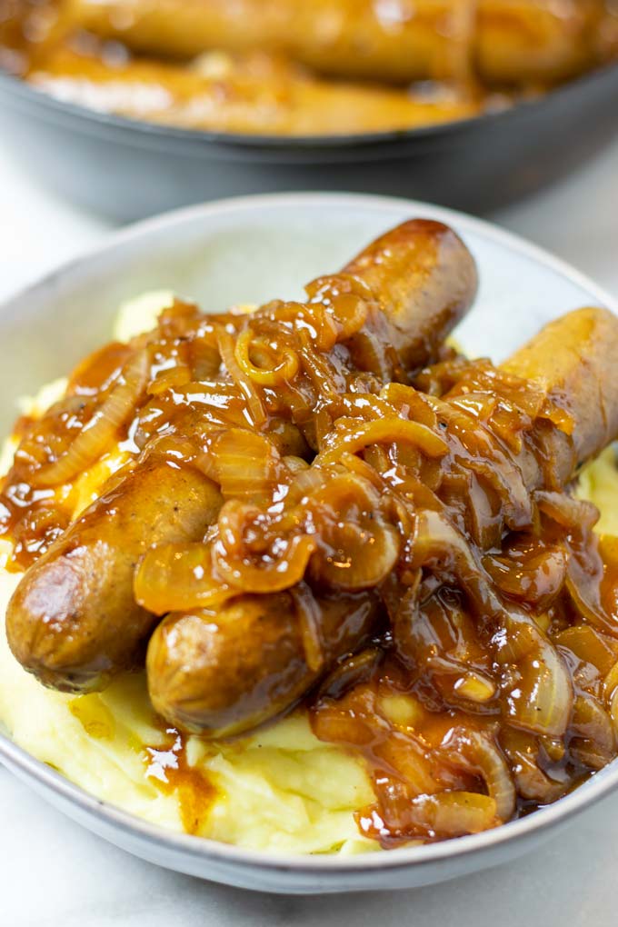 Large portion of the Mashed Potatoes with Sausages with lots of onion gravy.