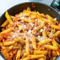 Fresh vegan parmesan is sprinkled over the pasta.