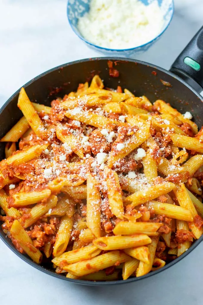 Fresh vegan parmesan is sprinkled over the pasta.