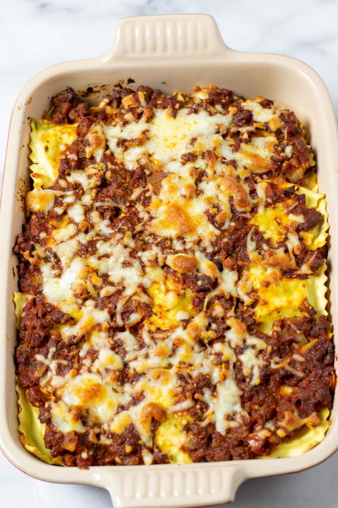 View of the ready baked Ravioli Lasagna in a casserole dish.