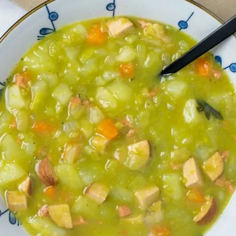 Portion of the Split Pea Soup in a large bowl, with a black spoon.
