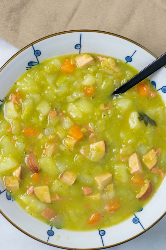 Portion of the Split Pea Soup in a large bowl, with a black spoon.