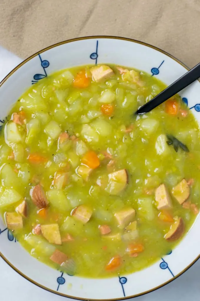 Portion of the Split Pea Soup in a large bowl, with a black spoon.