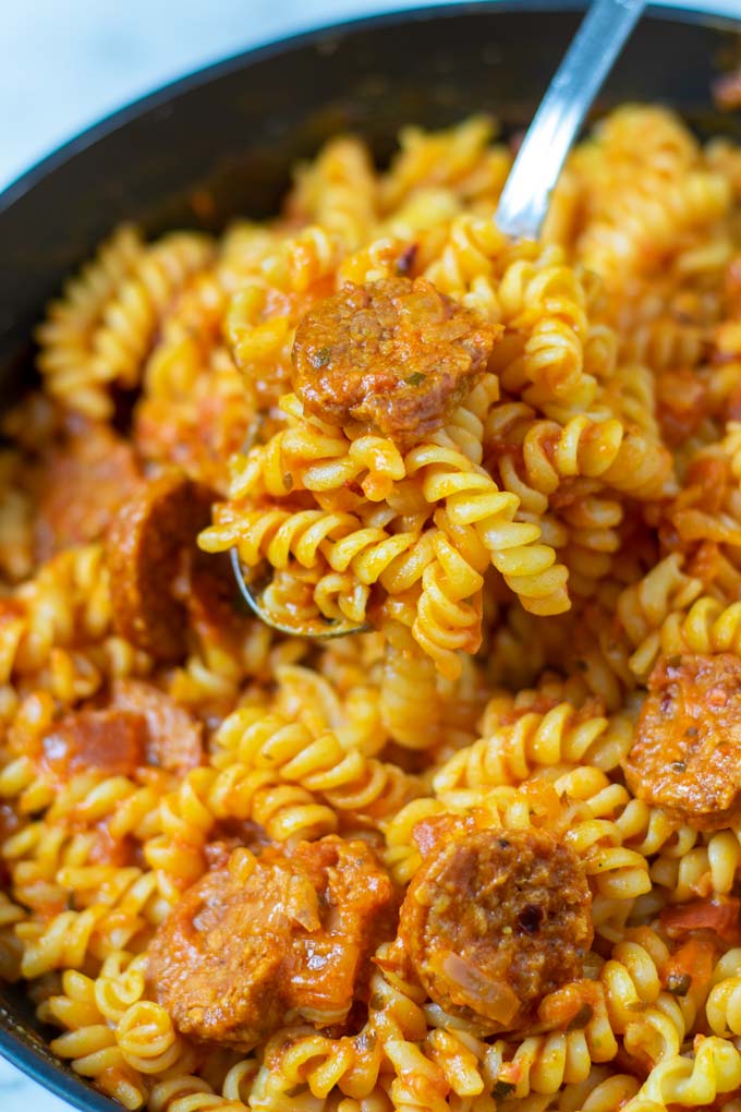 Closeup view of a large spoon of Chorizo Pasta.