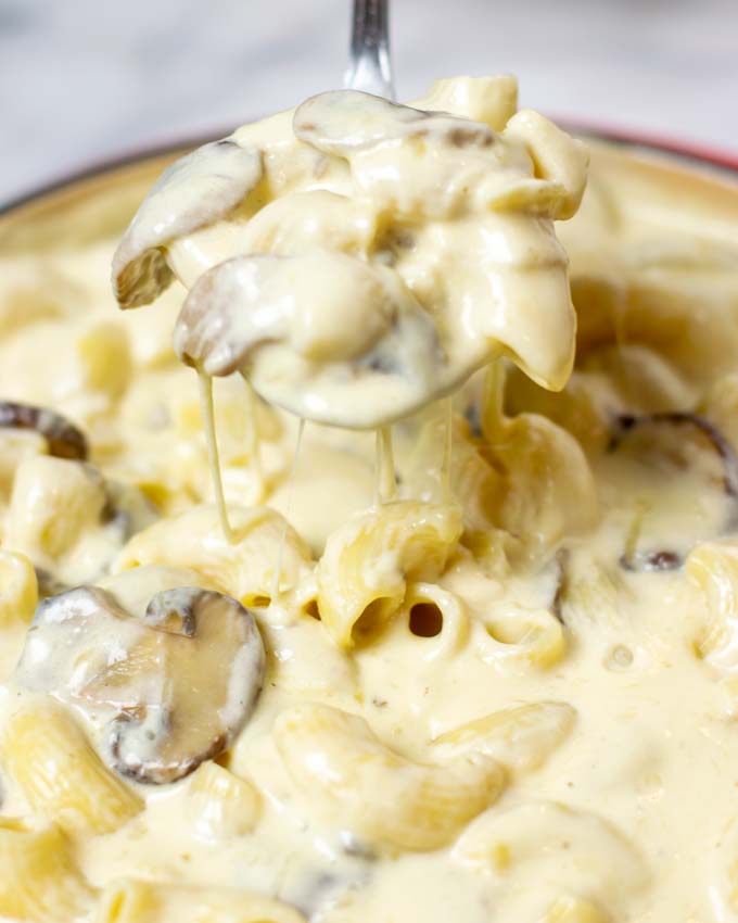 Closeup on a large spoon of the Truffle Mac and Cheese.