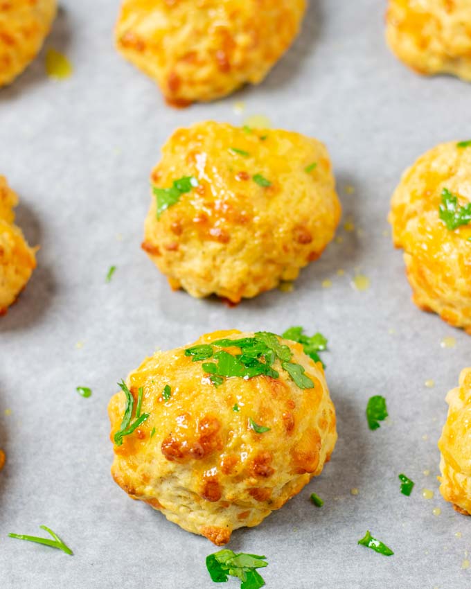 Cheddar Bay Biscuits garnished with fresh parsley.