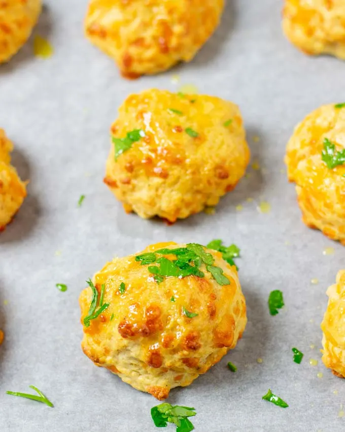 Cheddar Bay Biscuits garnished with fresh parsley.