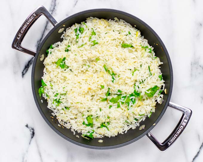 Top view of the mixed and fried Lemon Rice in a large sauce pan.