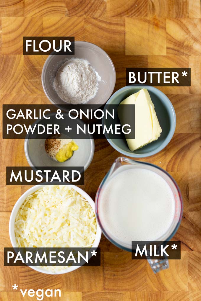 Ingredients needed to make this one pot Mornay sauce are assembled on a wooden board. Ingredients are labeled.