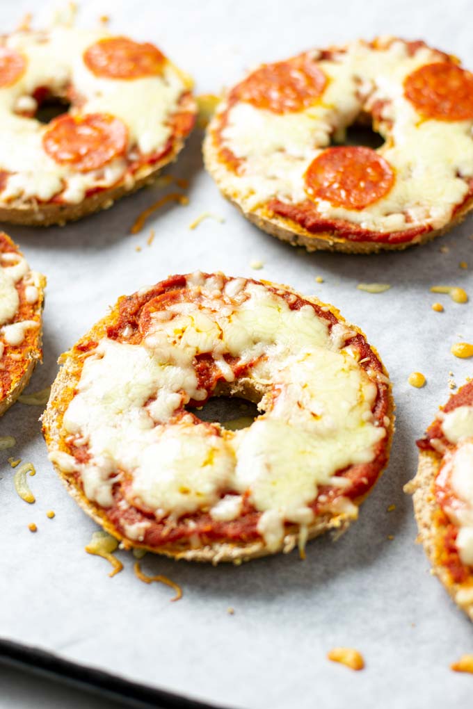 Closeup on a Pizza Bagel with melted vegan cheese topping.