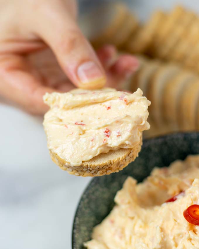 Closeup view of a slice of bread with Tirokafteri.