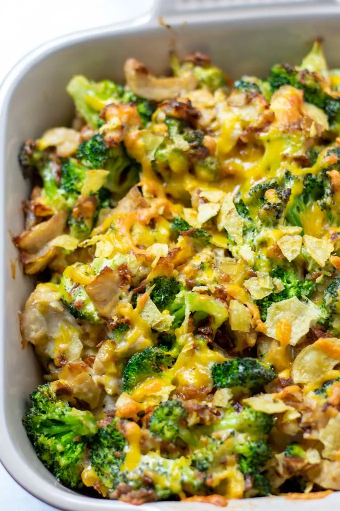 Chicken Broccoli Casserole as it comes fresh out of the oven, with the topping from vegan cheese and crushed potato chips clearly visible.