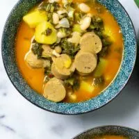 Top view on a serving bowl with one portion of the Kale Soup.