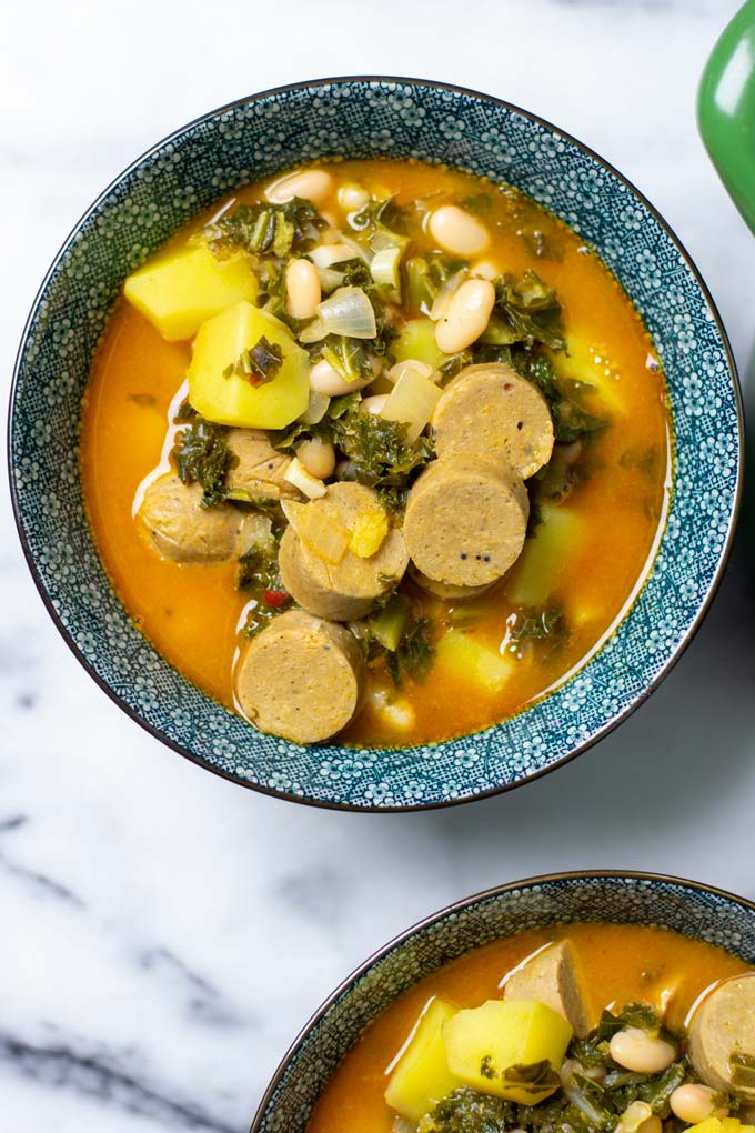 Top view on a serving bowl with one portion of the Kale Soup.