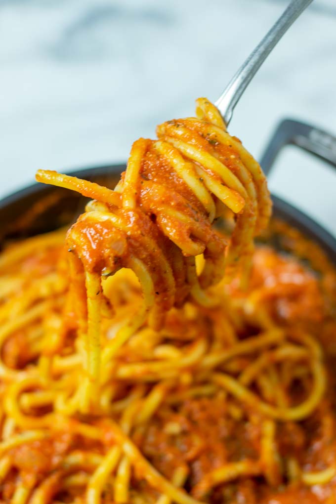 A fork full of pasta with the Pomodoro Sauce.