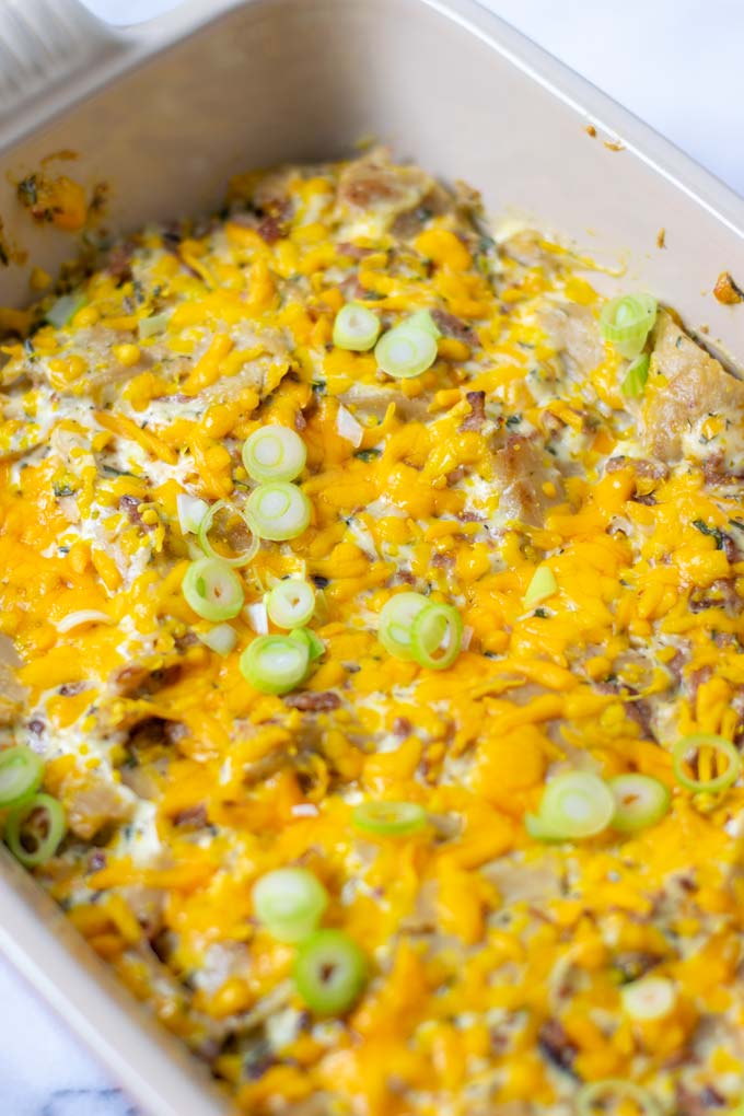 View of the Crack Chicken after baking, with the golden vegan cheddar crust and sprinkled with fresh green onion. 