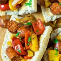 Closeup of several open sandwiches on a board.