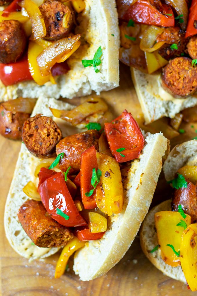 Closeup of several open sandwiches on a board.