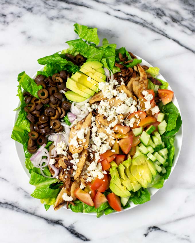 Top view of a large plate with a full serving of the Cobb Salad.