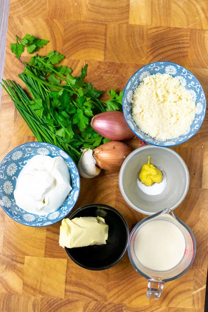 Ingredients for making Steak Sauce are collected on a wooden board.