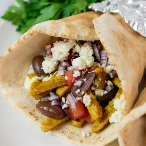 Closeup view on the filling of a Chicken Gyro.